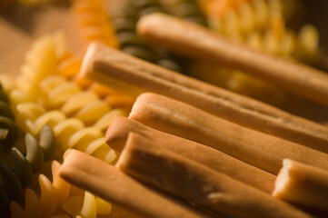 Close-up of breadsticks with pasta