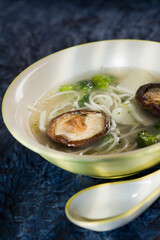 High angle view of a bowl of mushroom and noodle soup