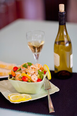 Close-up of shrimp salad served with white wine
