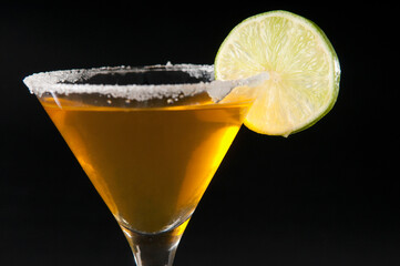 Close-up of a glass of cocktail with lime slice