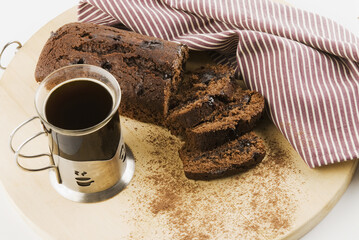 Close-up of a cup of coffee with chocolate cake
