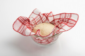 Dough with a napkin in a bowl