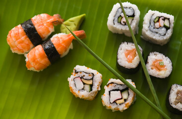 Close-up of various sushi on a leaf