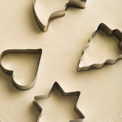 Pastry cutters on dough