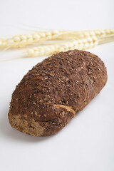 Close-up of bread with ears of wheat