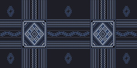 Seamless pattern based on Tai Dum tribal embroidery pattern. Indigo and blue tone color stitch on midnight blue background. Idea for printing on fabric or wallpaper.