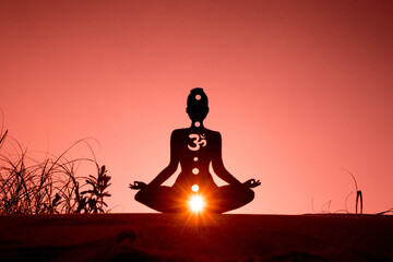 yoga position silhouette in contrasting sun, Root Chakra