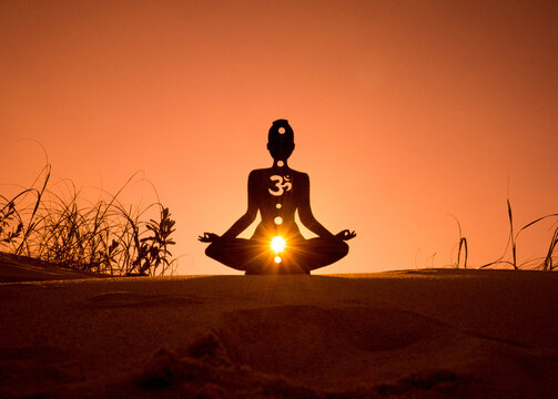 yoga position silhouette in contrasting sun, Sacral chakra