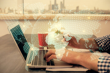Double exposure of man hands holding a credit card and internet business theme drawing. Digital fintech and E-commerce concept.