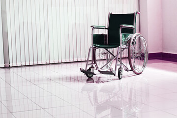 Wheelchair for patients waiting for services in hospital hallway, Selective focus 