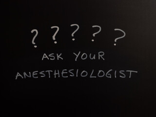 Ask Your Anesthesiologist written on a black chalkboard with question marks