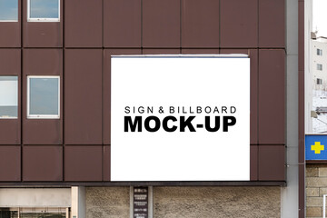 Mock up square shape blank billboard on panel of building