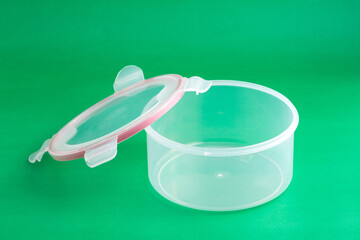 Multipurpose Plastic Container With Airtight Lid; Photo On Green Background.
