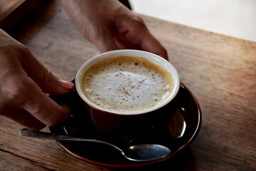 Top view cup of coffee on the wooden
