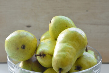 Several ripe pears close up in plate.