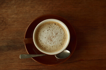 Top veiw cup of coffee on the wooden