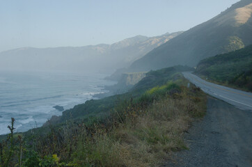 Foggy coast lines, with coast mountains ridges lining the horizon.  Part of the Big Sur drive., it rained over nght and sun was having trouble lifting the fog.