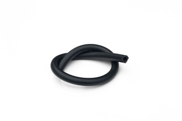 Black rubber fuel hose isolated on white background.