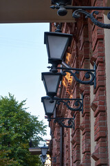 The image of lamps on the facade of the building.