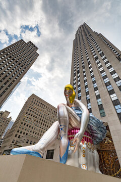New York, USA - 10 July, 2017: Jeff Koons's inflated 'Seated Ballerina' sculpture in Rockefeller Plaza in New York City.