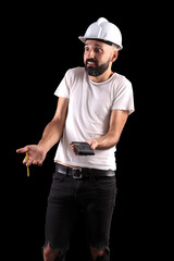 Confused young male construction worker perplexed by the results