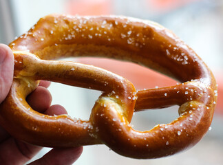 Brezel pretzel is a knotted kind of bread covered in salt that is popular in Berlin.