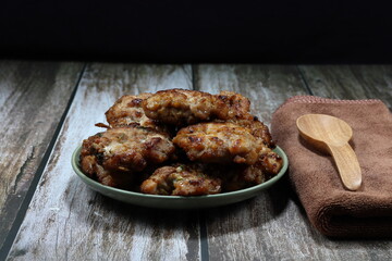 Roasted or Grilled pork meat on the plate. Famous party menu in Asia. Traditional deep fried chopped pork with local spices and sauce.