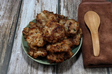 Roasted or Grilled pork meat on the plate. Famous party menu in Asia. Traditional deep fried chopped pork with local spices and sauce.