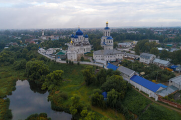 View of the Svyato-Bogolyubsky Convent on a cloudy August morning (aerial footage). Bogolyubovo, Russia