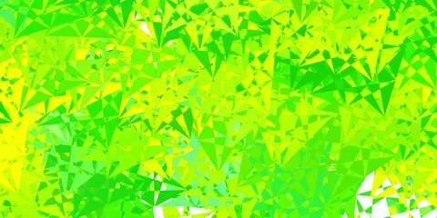 Light green, yellow vector background with polygonal forms.