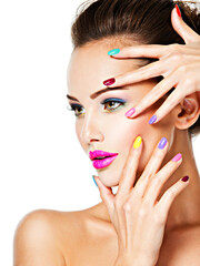 beautiful woman  with multicolor nails and fashion makeup