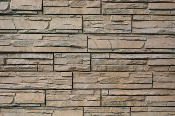 brick texture in the form of light beige masonry; abstract background for the design, facade and Foundation of the building