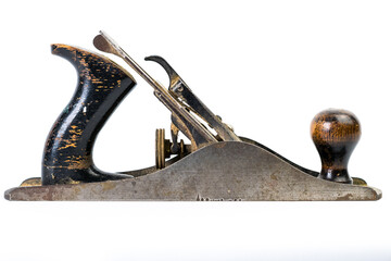 Wood working hand plane.  Well used and worn, isolated on a white background.  Close up of antique hand tool, with lots of wear and tear.