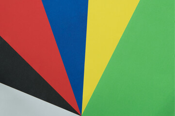 Green,yellow,blue,red,black,white color paper background,cardboard texture.