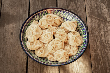 Ready-made manti in a national large plate.