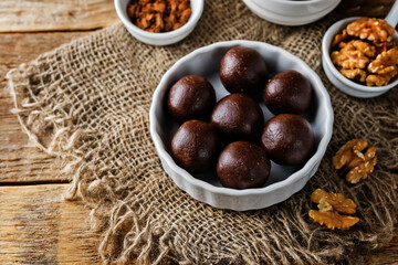 Dates walnuts chocolate raw balls in a plate