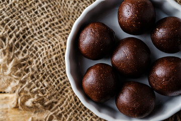 Dates walnuts chocolate raw balls in a plate