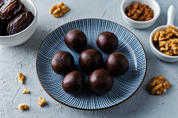Dates walnuts chocolate raw balls in a plate