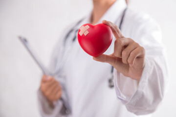 Woman hold red heart. on isolated white background. Happy charity volunteer concept, world heart day.