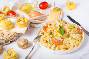 tagliatelle pasta on a white table, italian menu