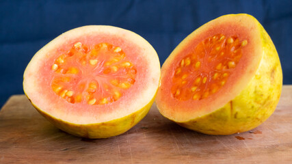 Red Guava on top Wooden base of a tray