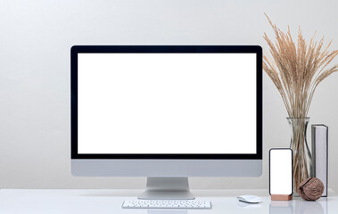 Mockup desktop computer and smartphone with blank screen on white top table.