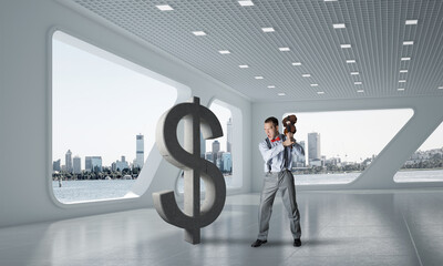 Determined banker man in modern office interior breaking dollar figure