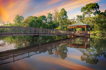Fototapeta premium A sunny day photo of a bridge reflected in the water