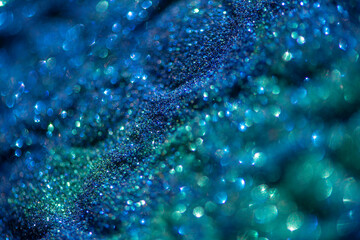 Abstract glitter lights colorful bokeh background in blue and green color tones