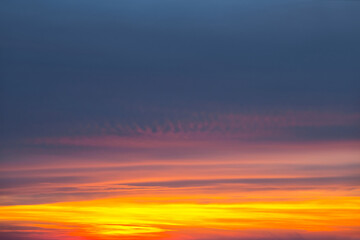 Obraz premium dramatic sunset over a cloudy sky, evening sky background