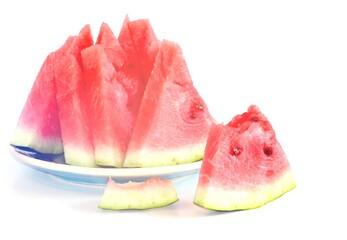 Pieces of juicy ripe sweet natural watermelon on white. Useful vitamins in summer. Seasonal fruits and berries.