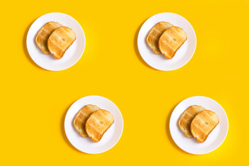 yellow background with food, toast on a plate