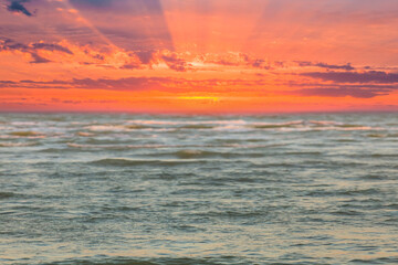 Fototapeta premium emerald sea at the red dramatic sunset