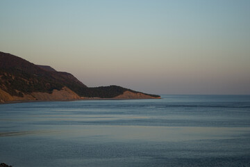 beautiful view of the sea and rocky coast in the evening at sunset